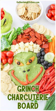 Make your Christmas charcuterie board a crowd-pleaser with this Grinch-themed layout. Spread guacamole in the shape of the Grinch's face, accentuated with bell peppers and olives for his eyes and smile. Design a Santa hat using cheese and chorizo, finished with a cucumber pom pom. Surround with a selection of pretzels, cherry tomatoes, and olives, perfect for dipping and snacking during the holiday festivities. Grinch Charcuterie Board, Grinch Ideas, Charcuterie Appetizers, Appetizer Tray, Appetizers For Kids, Grinch Christmas Party