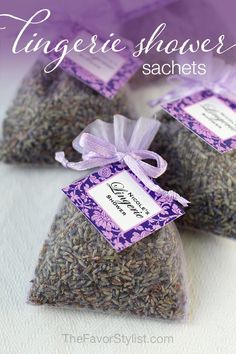 three bags of lavender shower sacs with tags on them