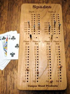 a wooden board with some playing cards on it