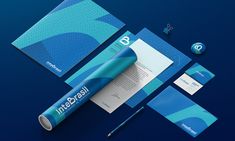 the stationery is designed to look like it has been made with blue and turquoise colors