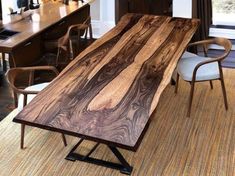 a large wooden table sitting in the middle of a room