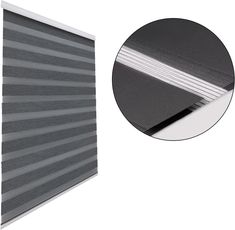 an image of a roller blinds with grey and white stripes on the bottom, and one side