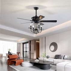 a living room with a couch, coffee table and ceiling fan that is black in color