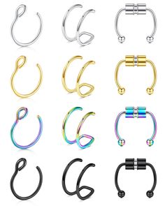 six different types of metal nose rings with clippers on each side and one has an open