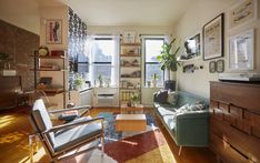 a living room filled with furniture and lots of windows next to a window sill