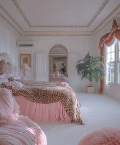 a bedroom decorated in pink and leopard print