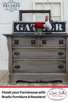 an old dresser with a rooster on top and the words gator painted on it