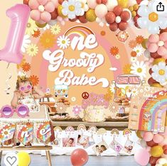 an assortment of desserts and balloons on a table with the words me groozy bake above it