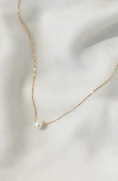 A single freshwater pearl makes a simple yet stunning statement on this delicate chain necklace. 16" length Pearl size: 8mm 14k-gold fill/freshwater pearl Made in the USA Pearl Necklace Bridesmaid, Gold Pearl Accessories, Pearl Necklace With Gold Chain, Gold Chain And Pearl Necklace, Gold Necklace For Prom, Strapless Wedding Dress Necklace, Pearl Ring Aesthetic, Gold Pearl Jewelry Set, Simple Pearl Jewelry