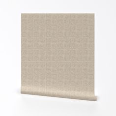 a beige wallpaper with small squares on the top and bottom, against a white background