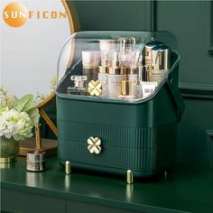 a green suitcase with lots of bottles in it on top of a table next to a mirror