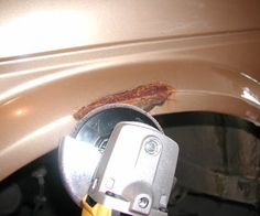 a close up of a car door handle and the front part of it's bumper