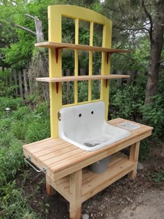 a wooden bench with a sink built into it