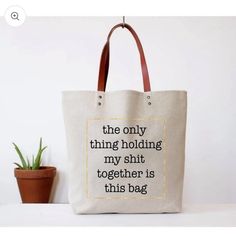 The Only Thing Holding My Shit Together Is This Bag. What A Fun Gift For The Woman With A Wicked Sense Of Humor! A Great Gift For A Busy Mom Or Business Woman On The Go And Perfect For Grocery Store Shopping, A Trip To The Library Or A Weekend Getaway Bag. Cotton Tote Bag With Light Brown Faux Leather Handle. 15" (W) X 16.5" (H). Gold Metallic Printed Border And Black Print. Functional Zipper Closure. Never Carried. Light Spot On Back, See Photo. Bag Quotes, Funny Tote Bags, Kids' Bag, Wine Gift, Work Bag, Storage Bags, Cotton Tote Bag, Hold Me, Cricut Ideas