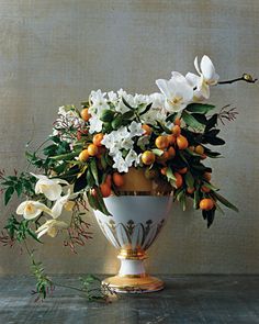 a magazine cover with flowers in a vase