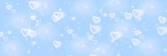 many hearts are floating in the air on a blue background with white stars and snow flakes