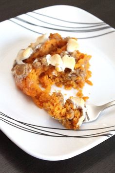 a white plate topped with a piece of cake