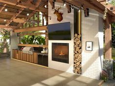 an outdoor living area with fireplace, grill and television on the wall in front of it