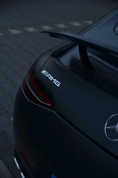 the back end of a black mercedes car