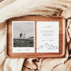 two photos on a wooden frame with the same photo in it, and an envelope