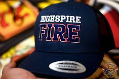 a hat with the words mississippi fire on it is held up by someone's hand