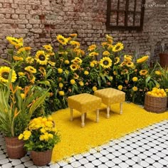 two yellow stools sitting in the middle of a flower garden with sunflowers