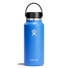 the hydro flask water bottle is blue with a black lid and has a white logo on it