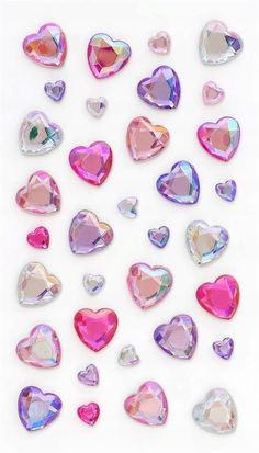 many different colored hearts are arranged in the shape of heart shaped shapes on a white background