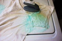 an image of a brush on top of a t - shirt that says goodbye to armpit stains