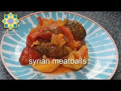 a blue and white plate topped with meatballs