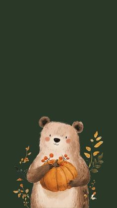 a bear holding a pumpkin in its paws