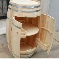 a wooden barrel with two shelves on the outside