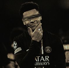 a man with his hand on his face