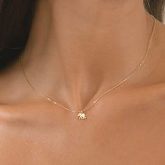 Introducing our Elephant Necklace, a symbol of wisdom, strength, and good luck, available in your choice of 14k Gold Filled, Sterling Silver, or 14k Rose Gold Filled. Crafted with exquisite attention to detail, our elephant pendant captures the majestic beauty and gentle nature of these magnificent creatures. The intricate design showcases the elephant's iconic features, from its gracefully curved trunk to its intricately textured skin, creating a piece that is both striking and meaningful. Elephants are revered in many cultures as symbols of wisdom, loyalty, and prosperity, making this necklace a thoughtful and symbolic gift for yourself or a loved one. Whether worn as a daily reminder of inner strength and resilience or as a token of well wishes, our Elephant Necklace is sure to become a Symbols Of Wisdom, Textured Skin, Initial Disc Necklace, Engraved Bar Necklace, Elephant Jewelry, Symbol Of Wisdom, Gold Elephant, Bar Necklace Personalized, Good Luck Gifts