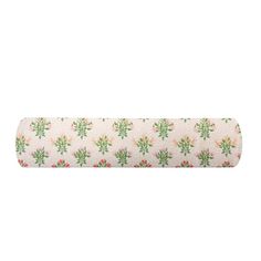 a roll of toilet paper with green and pink flowers on the bottom, in front of a white background