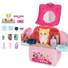 this is an image of a toy pet grooming machine with toys and accessories in it