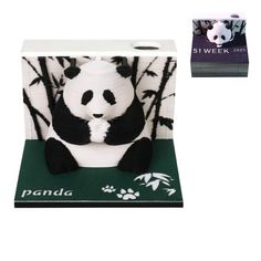 a panda bear tissue box sitting on top of a green mat