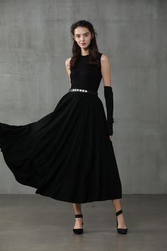 "Winter days do not mean that you need to resign to elegance. Boasting a soft wool-blend construction, this spiral skirt from Linennaive proves that you can be elegant and warm at the same time. Featuring a high waist, a rear zip fastening, a flared style, side pockets and a midi-length. 【Material】 -Wool 87%, Elastane 13% 【Length】 32-33 inches. 【Size】 *SIZE XS length: 32\"/82 cm waist: 26\"/ 66 cm *SIZE S length: 32\"/82 cm waist: 27\"/ 70 cm *SIZE M length: 32\"/82 cm waist: 29/ 75 cm *SIZE L l Elegant Asymmetrical Maxi Skirt For Fall, Evening Midi Maxi Skirt With Relaxed Fit, Winter Evening Midi Skirt, Black Evening Skirt For Winter, Elegant Winter Party Maxi Skirt, Elegant Evening Maxi Skirt For Fall, Elegant Winter Lined Maxi Skirt, Fall Evening Midi Skirt, Elegant Winter Maxi Skirt With Lining