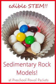 a bowl filled with candy and marshmallows on top of a red frame