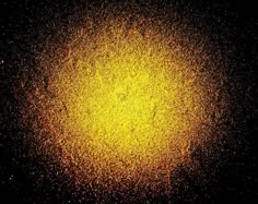 an image of yellow dust in the dark