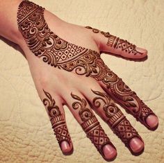 henna tattoo on the palm of someone's hand