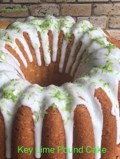 a bundt cake with white icing and green sprinkles