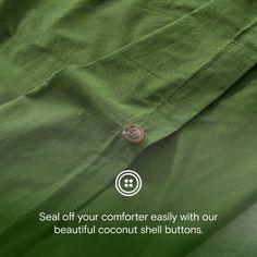 a button on a green shirt that says seal off your comforter easily with our beautiful coconut shell buttons