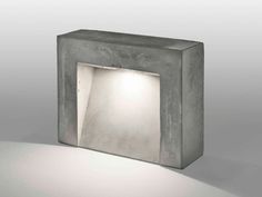 a concrete block with a light in the middle