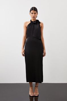 Sophistication Merges With Sultry Allure With This Slinky Midi Dress. Crafted From Tailored Lustrous Satin That Falls From A Halter Neck Tie Detail To Split Hem Detail. Featuring A Backless Design With A Glamorous Chain Detail, Pair This Piece With Bold Heels For Elegant Formal Wear. Satinmidi Lengthchain Detailfitted Bold Heels, Pencil Midi Dress, Midi Pencil Dress, Backless Design, Karen Millen, Pencil Dress, Split Hem, Fashion Face, Black Midi Dress