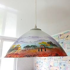 a lamp hanging from the ceiling in a room