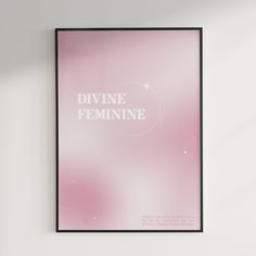 a pink poster with the words divine feminine in white lettering on it against a white wall