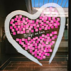 there is a heart made out of sticky notes