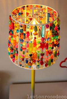 a colorful lamp with lots of beads on it