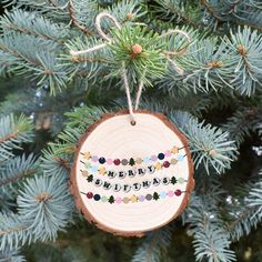 a wooden ornament hanging from a tree